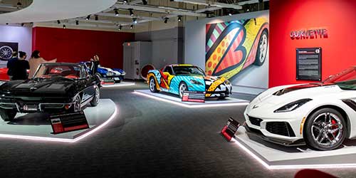 Classic and modern sports cars displayed inside the Newport Car Museum in Rhode Island.