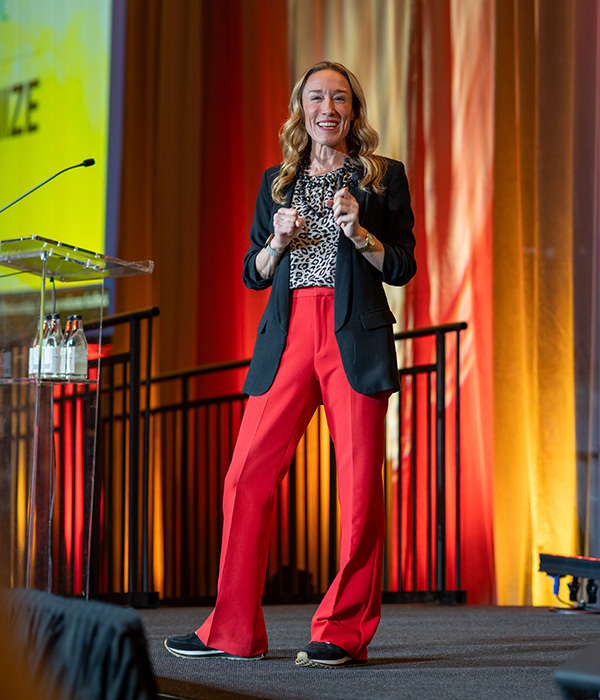 Woman on stage speaking