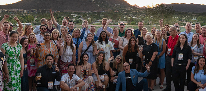 deamcon25-pano2-675x300 Large group of people with mountains in the background