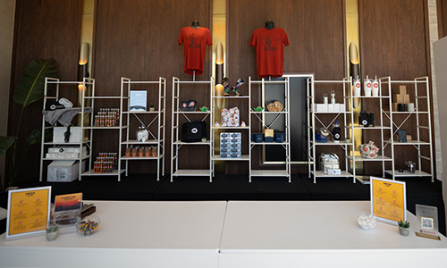 Shelves with different give-aways behind a desk